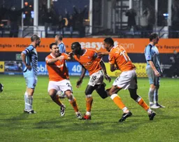 Claude Gnakpa has just scored Town`s first goal. Kevin Gallen and Shane Blackett look quite happy about it too