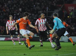 Tom Craddock watches as the ball flashes across the Saints goalmouth
