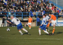 Tom Craddock tries his luck with a long range shot at goal