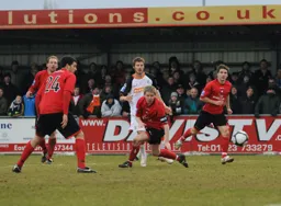 Everyone watches as the ball flashes past a post