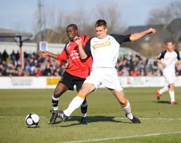 Janos Kovacs is at full stretch to win the ball