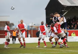 Claude Gnakpa heads in his and Town`s first goal to level the scores