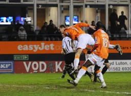 Liam Hatch sends a header goalwards