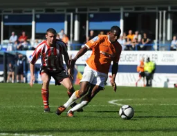 Adam Newton bursts into the penalty area