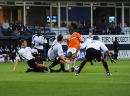 Claude Gnapka facing some of the resolute Newport defence that earned them a draw and stopped our 100� record