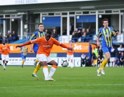 Amari Morgan-Smith scores one of his hat-trick of goals to seal a place in the FA Cup proper