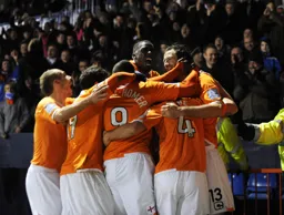 The team celebrate the opener from Kroca