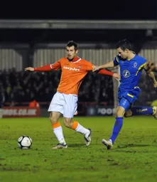 Alex Lawless who a week earlier had joined Luton on a permanent basis in control in midfield