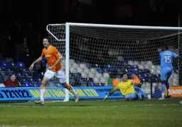 No difficulty seeing who scored the fourth for Luton as Zdenek Kroca wheels away to celebrate