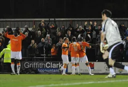 Owusu Willmott and Howells celebrate with the Town faithful that visited the Cotswolds