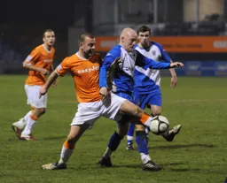 Keith Keane wins the tackle before wheeling away from the Barrow player