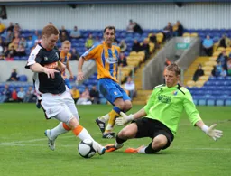 Jason Walker rounds the keeper but cannot find the net