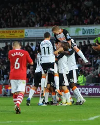 The players celebrate the third from Ed Asafu-Adjaye