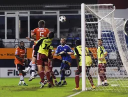 Dean Beckwith rises above former Hatter Luke Graham to head in Town`s equaliser