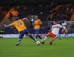 Ben Futcher and James Dance go in with studs showing