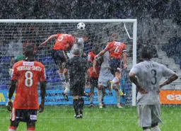 Dean Beckwith defends the goal as the rain pours down