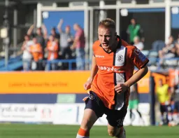 Adam Watkins celebrates his goal