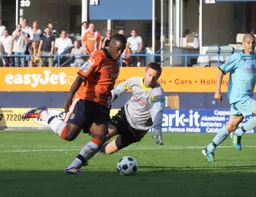 Amari Morgan-Smith rounds the keeper to complete the rout with the fifth goal