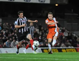 Adam Watkins tries a shot of goal