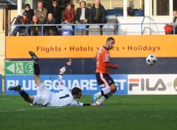 Stuart Fleetwood rounds the keeper and slots the ball into the net for the fourth goal