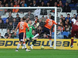 Kevin Pilkington saves Ade Akinfenwa`s header