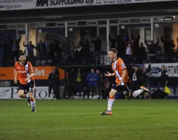 Adam Watkins has just scored the only goal of the game.