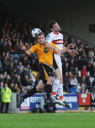 Future Hatter Luke Berry feels the full force of Jamie Hand`s elbow