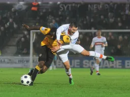 Greg Taylor gets to grips with Ishmail Yakubu