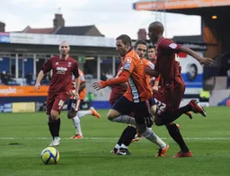 Robbie Willmott gets past Sido Jombati