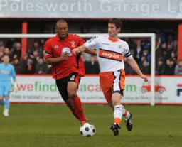 George Pilkington brings the ball away from Kieron St. Aimie