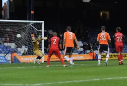 Greg Taylor and Janos Kovacs watch as Jake Howells`s opener flies into the net