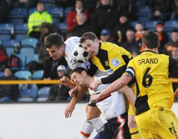 Janos Kovacs and George Pilkington combine to clear the ball