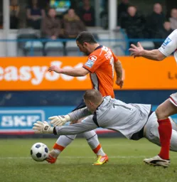 Stuart Fleetwood rounds the keeper for the first goal