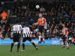 Keith Keane wins a midfield header