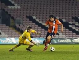 Craig McAllister tries to go around Jordan Pickford