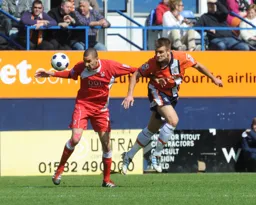 Janos Kovacs gets in an attacking header