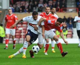Andre Gray wrestles for the ball with Nathaniel Knight-Percival