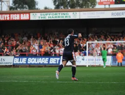 Stuart Fleetwood has just scored Town`s second goal. The travelling Hatters faithful celebrate in the background