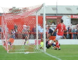 Scott Rendell forces the ball over the line from close range for Town`s second goal