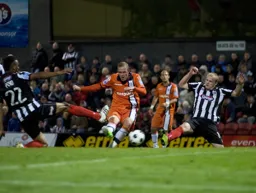 Scott Rendell`s shot evades two defenders