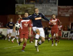 Scott Rendell brings the ball under control watched by former Hatter Tommy Wright