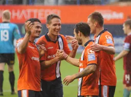 All smiles after Alex Lawless scored his and Town`s second goal