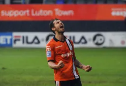 Alex Lawless shows his delight after scoring his and Town`s first goal