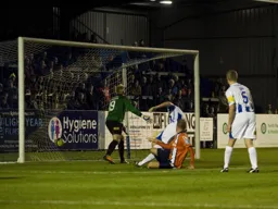 Down but not out. Scott Rendell scores his and Town`s first goal
