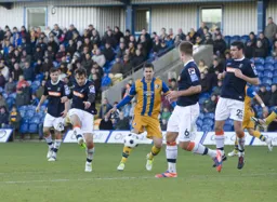 Alex Lawless tries his luck from the edge of the penalty area
