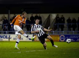 Scott Rendell fires in a shot at goal