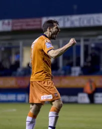Alex Lawless looks happy after scoring Town`s second goal