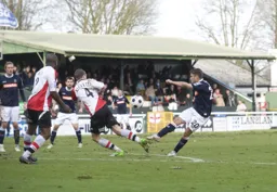 Scott Neilson tries his luck from the edge of the penalty area