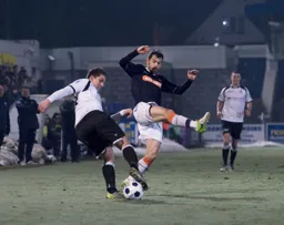 Alex Lawless attempts to block a clearance