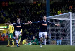 Goal provider JJ O`Donnell and goal scorer Scott Rendell celebrate the goal